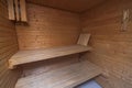 Close up view of sauna room interior. Wooden walls and seats. Royalty Free Stock Photo