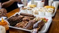 Close up view of the sausages, lamb meat and rib smoked barbecue on a food tray. Royalty Free Stock Photo