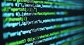 Close-up view of scrolling green computer code on a dark monitor screen Royalty Free Stock Photo