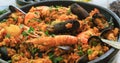 Close up view of a seafood paella: mussels, king prawns, langoustine, haddock Royalty Free Stock Photo