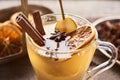 Close up view of seasonal traditional pear mulled wine with spices and dried citrus in glass. Royalty Free Stock Photo