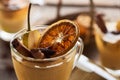 Close up view of seasonal traditional pear mulled wine with spices and dried citrus in glass. Royalty Free Stock Photo