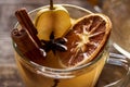 Close up view of seasonal traditional pear mulled wine with spices in glass. Royalty Free Stock Photo