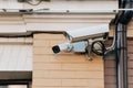 close up view of security cameras on orange colored