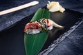 Close up view on served Nigiri with eel on dark plate on dark background with copy space. Delicious salmon Nigiri Sushi. Royalty Free Stock Photo