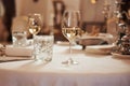 Close up view of served table with glass of champagne ready for visitors to celebrate