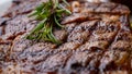 Close up view on serving of marinated grilled rib eye steak with baked potatoes and vegetables Royalty Free Stock Photo