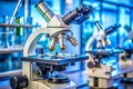 A close up view of several microscopes in a laboratory setting with blue lighting Royalty Free Stock Photo