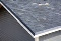 A close up view of shingles a roof damage. Roof Shingles - Roofing. Royalty Free Stock Photo