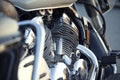 Close up view of a shiny chrome motorcycle design engine with ex Royalty Free Stock Photo