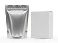 A close-up view of a shiny metallic pouch next to a plain white box Royalty Free Stock Photo