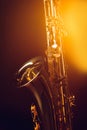 close-up view of shiny professional saxophone and spotlight