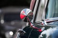 Close up view of shiny side view mirror on a classic car Royalty Free Stock Photo