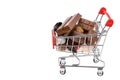 Close up view of shopping cart filled with candies and chocolate. Unhealthy food. Royalty Free Stock Photo