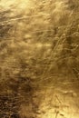 Gold foil art piece features intricate texture patterns. Close-up view showcases smooth to rough textures adding complexity. Gold Royalty Free Stock Photo