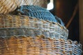 Close-up of old, stacked wicker baskets showcasing intricate weaving patterns and rustic textures in warm, natural light. Royalty Free Stock Photo