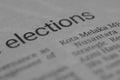 The close-up view showcases the word \'elections\' on a newspaper