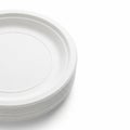Stack of White Disposable Paper Plates on White Background image photo Royalty Free Stock Photo