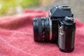 The side of an old black film camera with a red towel Royalty Free Stock Photo