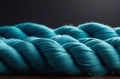 Close up view of skein of blue silk and merino wool on grey background