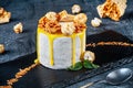 Close up view on slice of white cake with honey on dark backfround. Dessert food for breakfast. Served ready to eat sweets. Copy Royalty Free Stock Photo