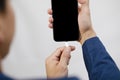 Close-up view of smartphone Charging Low battery, White USB Cable Connected With Mobile Phone on the white background Royalty Free Stock Photo