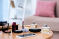 close-up view of smartphone and various cosmetics on table Royalty Free Stock Photo