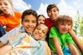 Close up view of smiling kids in a cuddle Royalty Free Stock Photo
