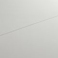 A close-up view of a smooth, light gray surface intersected by a thin, straight line. The Royalty Free Stock Photo