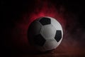 Close up view of soccer ball on dark background. FootSelective focus Royalty Free Stock Photo