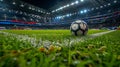 Close-up view of a soccer ball on a field with stadium lights and fans in the background in offenbach, germany Royalty Free Stock Photo