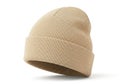 A knitted beige beanie hat with a textured pattern isolated on white background Royalty Free Stock Photo