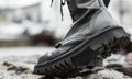 Close up view sole black leather boot on stone nature background Royalty Free Stock Photo