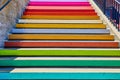 Close up view of solid colors on edge of pastel colored stairs