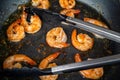 Spicy roasted shrimps in cast iron pan