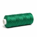Spool of Emerald Green Synthetic Thread on a White Background sewing craft Royalty Free Stock Photo