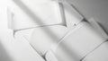 A close-up view of a stack of blank white envelopes with a shadow cast across them Royalty Free Stock Photo