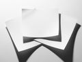 A close-up view of a stack of blank white papers with a shadow effect Royalty Free Stock Photo