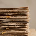 A close-up view of a stack of brown cardboard sheets, neatly piled. The cardboard Royalty Free Stock Photo