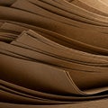 A close-up view of a stack of brown paper sheets, displaying their smooth texture and Royalty Free Stock Photo
