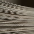 A close-up view of a stack of cardboard sheets. The edges of the sheets are clearly Royalty Free Stock Photo