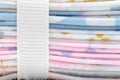 A close up view of a stack of fat quarters wrapped with white ribbon, side view Royalty Free Stock Photo