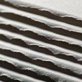 Close up view of a stack of paper sheets with uneven textured edges Royalty Free Stock Photo