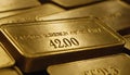 Stack of gold bars with embossed text and numbers precious metal Royalty Free Stock Photo