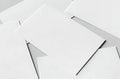 A close-up view of a stack of white papers with a pen on top. isolated on white background Royalty Free Stock Photo