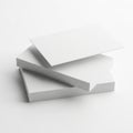 A close-up view of a stack of white and textured paper sheets on a light surface Royalty Free Stock Photo