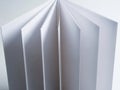 A close-up view of a stack of white, unlined paper sheets displaying their edges and texture Royalty Free Stock Photo