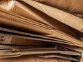 Close-up view of stacked corrugated cardboard layers, showcasing the intricate wave structure and texture, ideal for concepts like