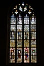 Close up view of stained glass window in the historic Notre Dame de Roncier church in Josselin