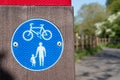 Close-up view of a standard pedestrian and cycle path sign. Royalty Free Stock Photo